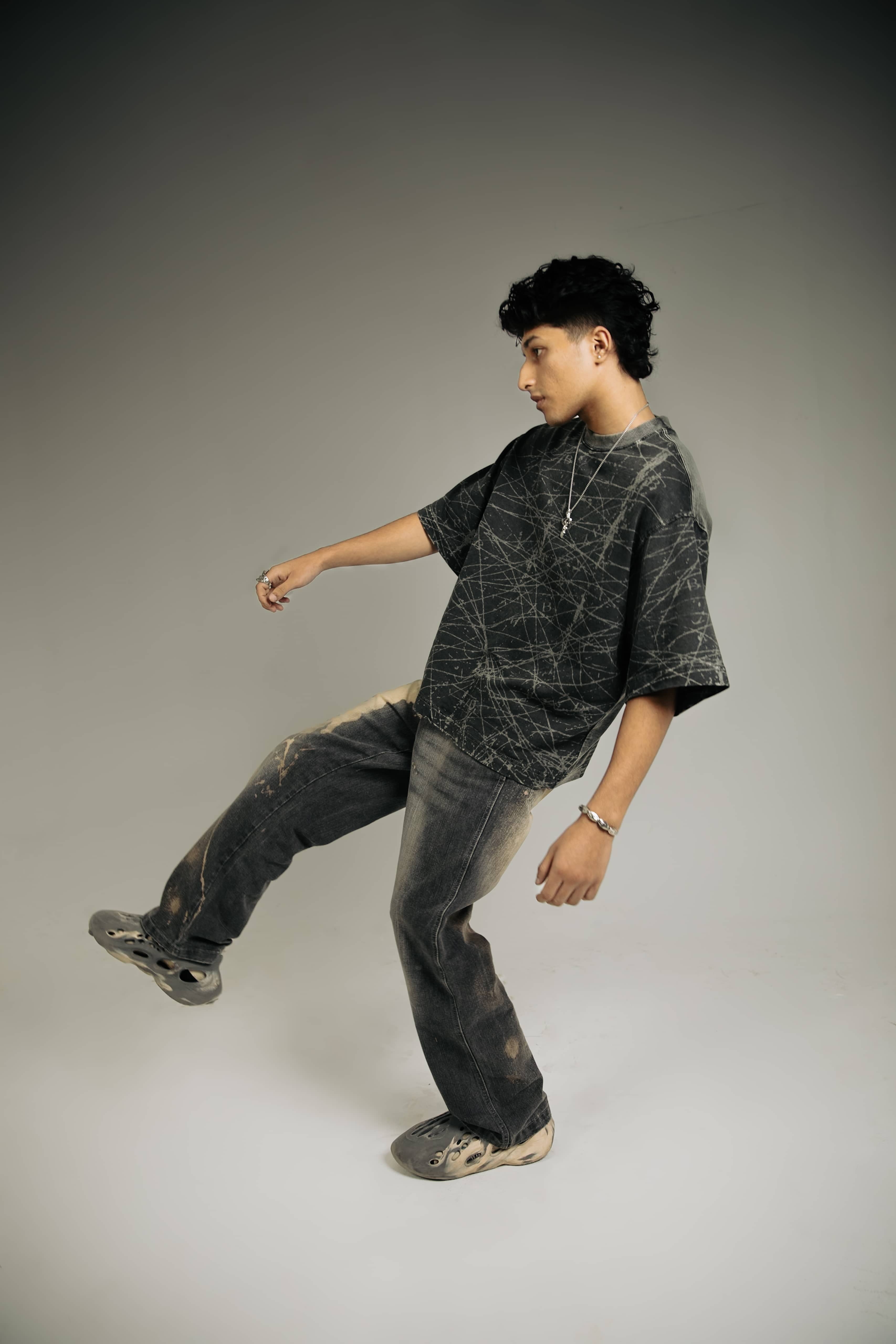 Cool oversized black acid-wash t-shirt for men, a bold addition to streetwear wardrobes