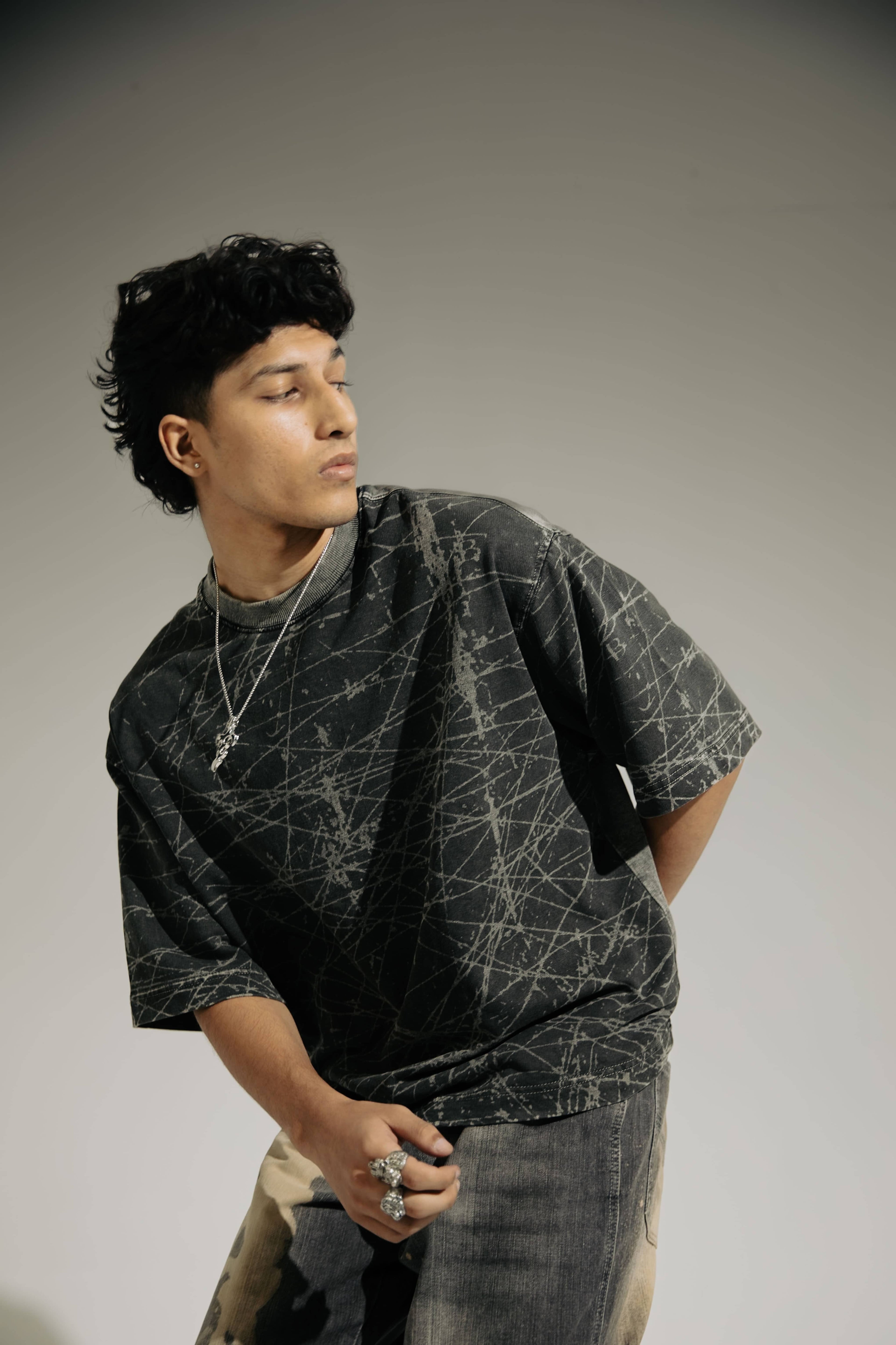 Sporty oversized black acid-wash t-shirt for men, casual streetwear fashion, perfect for layering