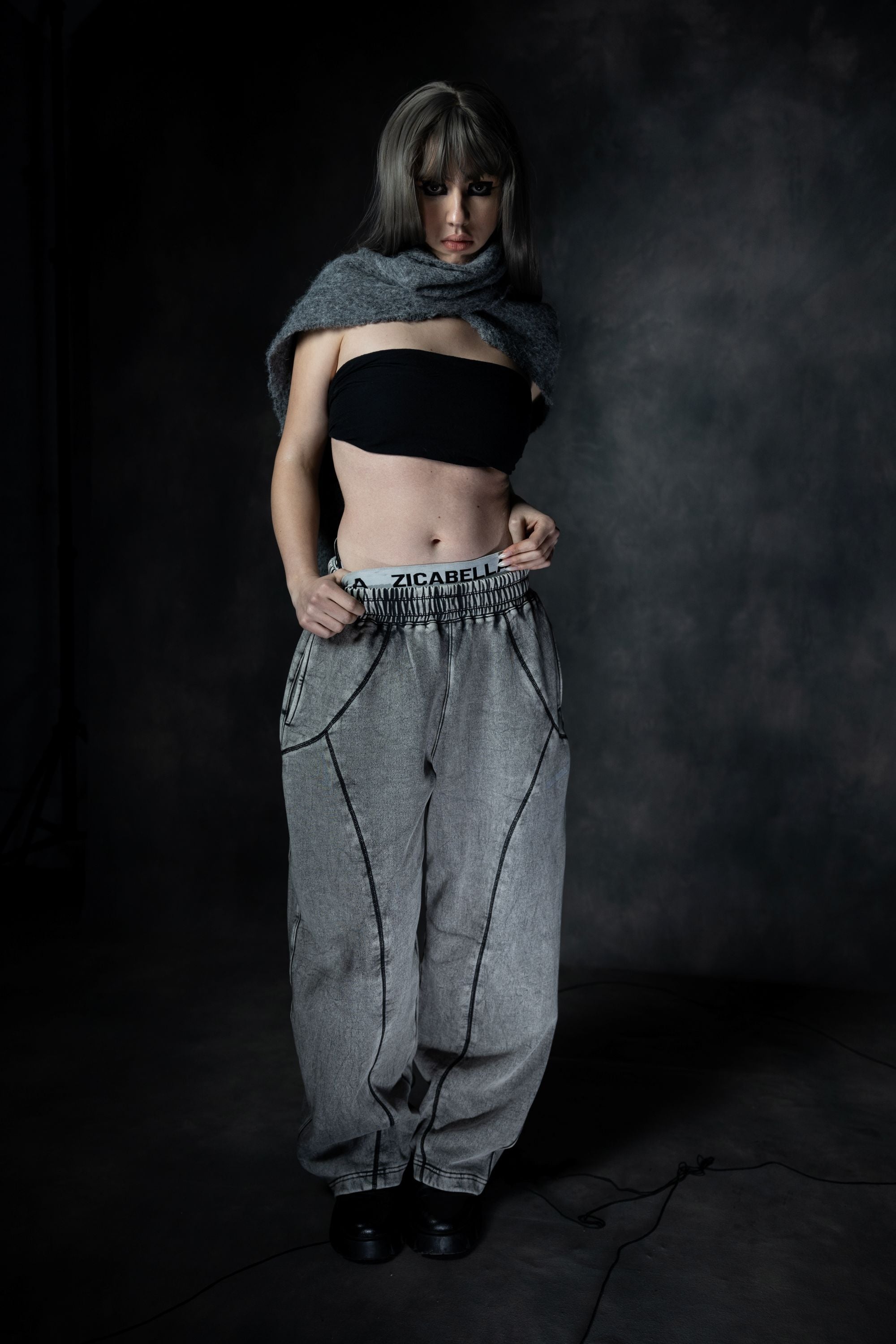 Oversized baggy lower styled in strong fashion pose with modern streetwear attitude