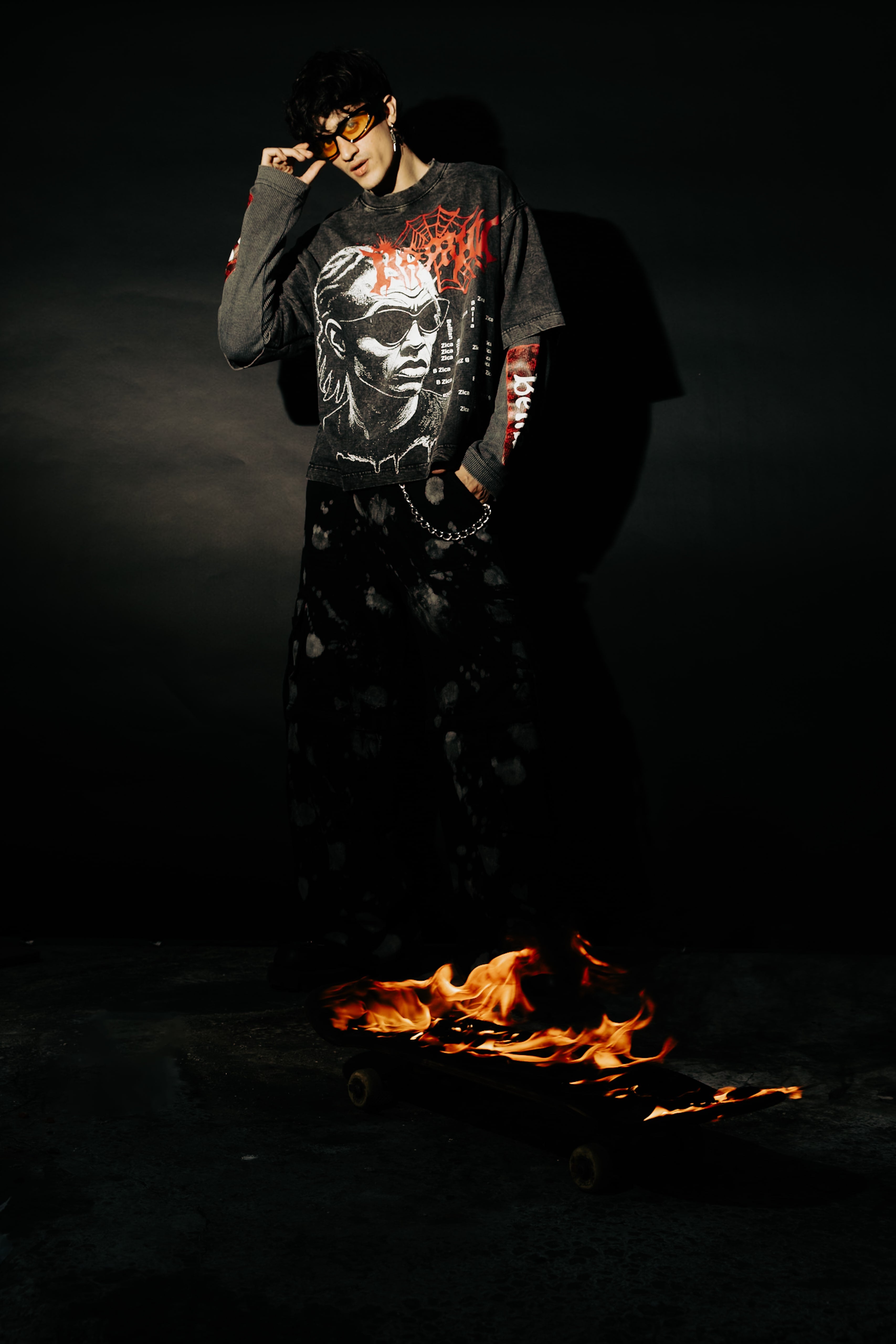 Street-inspired look featuring oversized black acid washed t-shirt with graphic design