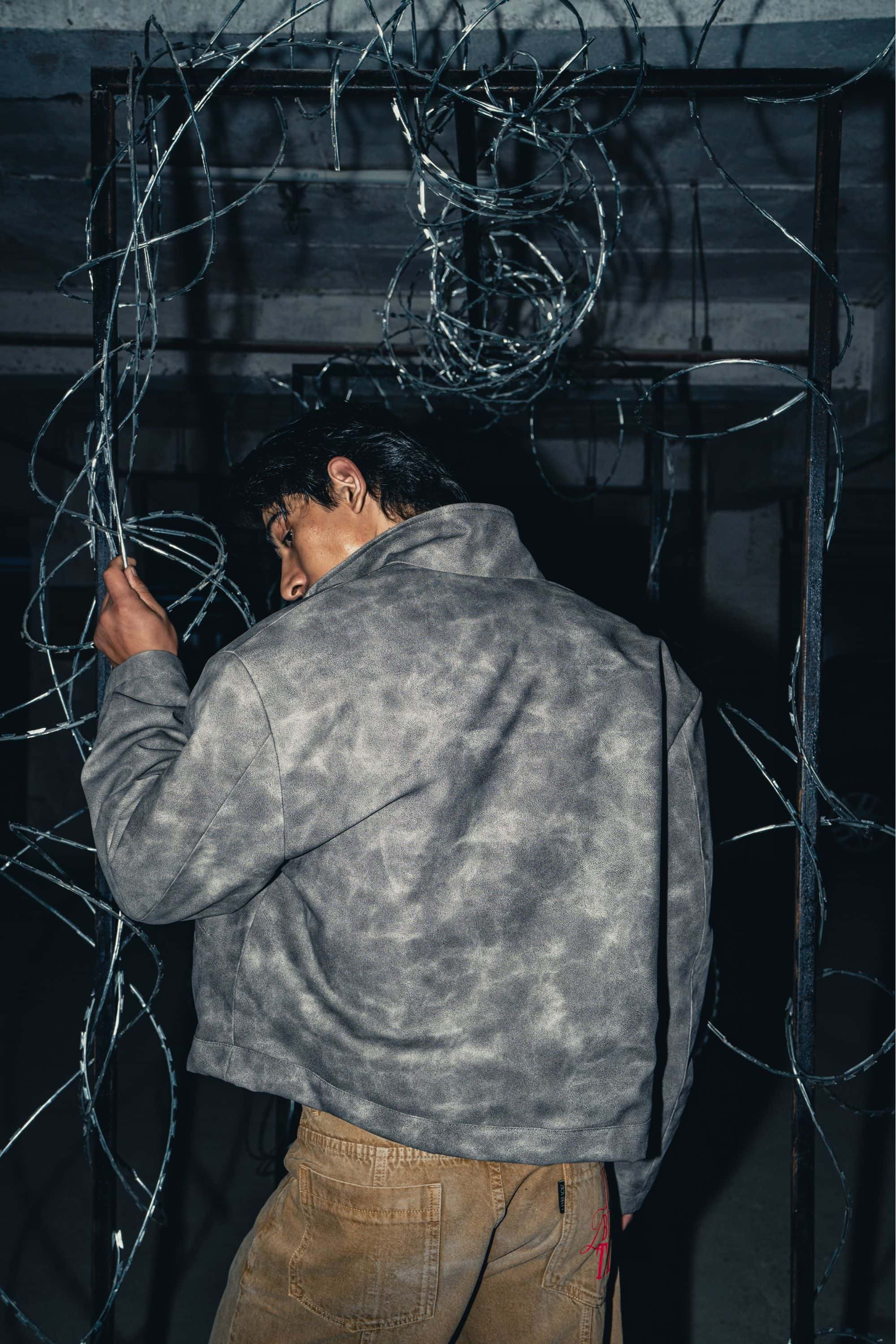 Modern oversized grey leather jacket with a relaxed fit, perfect for casual streetwear styling with high-quality craftsmanship