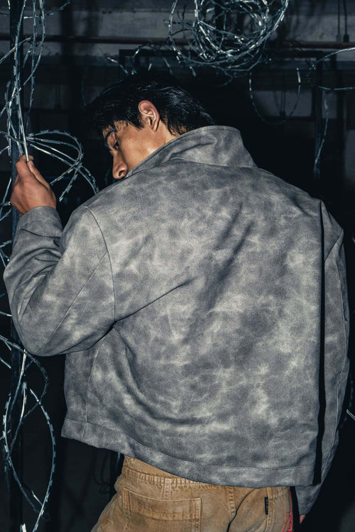 Modern oversized grey leather jacket with a relaxed fit, perfect for casual streetwear styling with high-quality craftsmanship