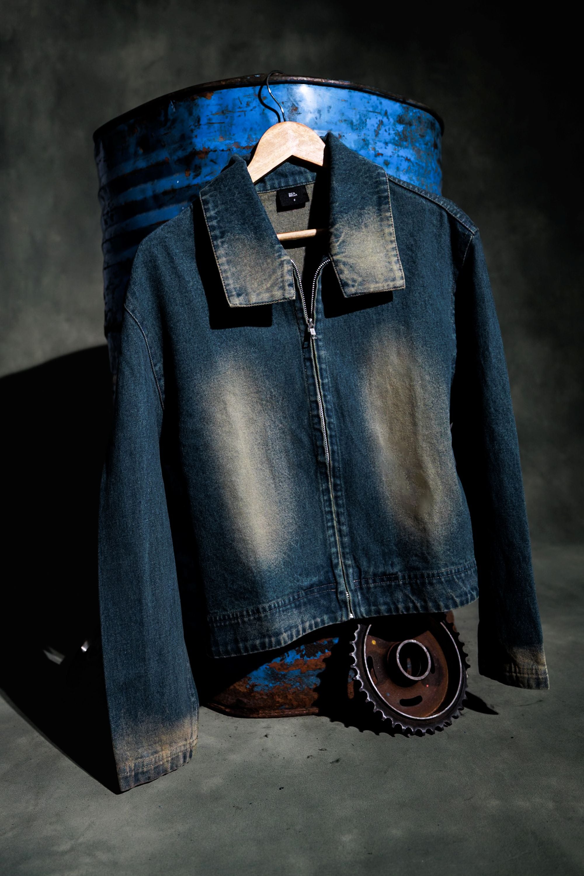 Premium denim jacket product shot highlighting fabric texture and quality
