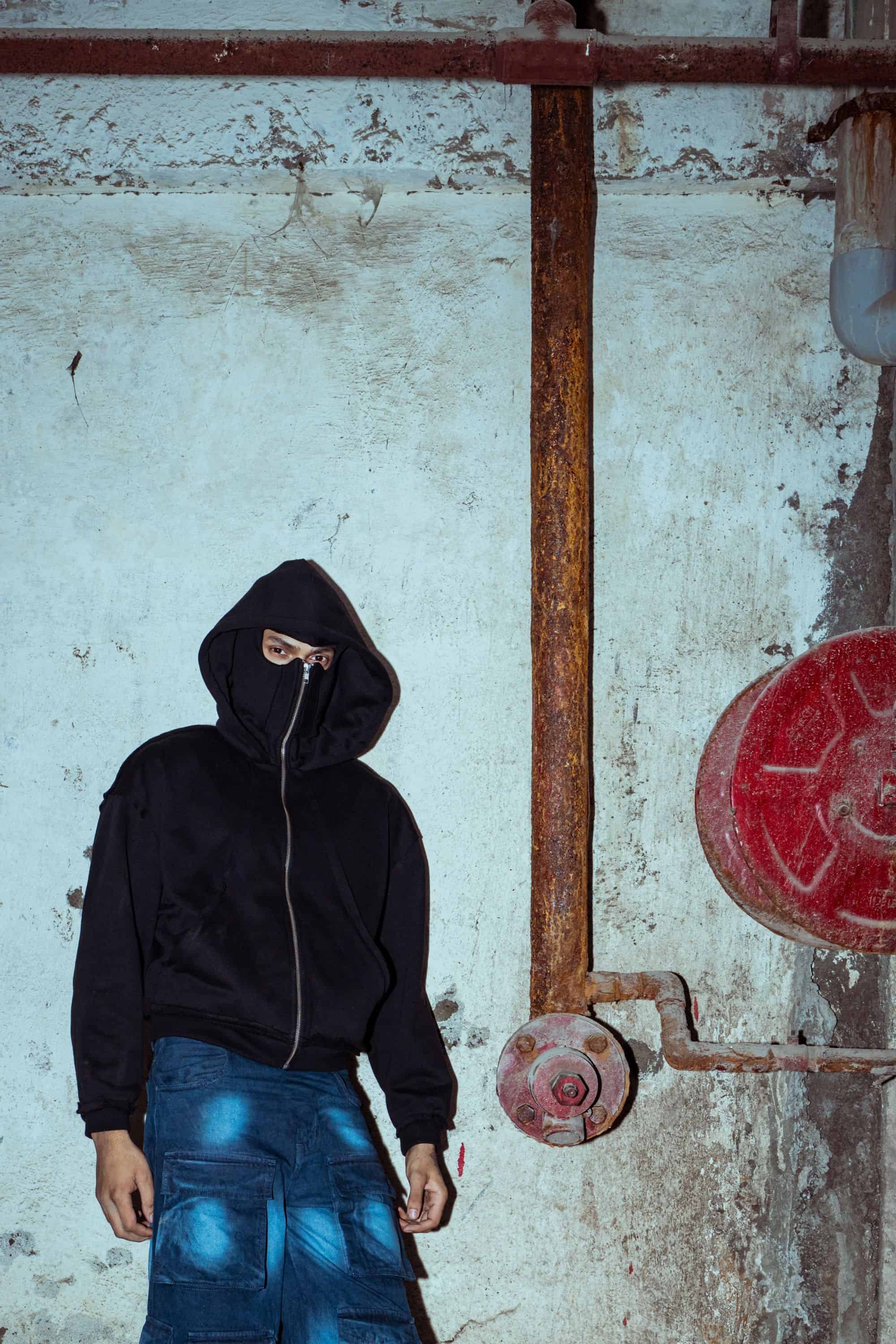 Premium black cotton hoodie with a modern fit, ideal for high-fashion street style