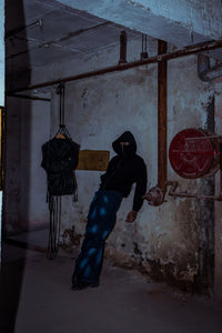 Premium black cotton hoodie with a relaxed fit, ideal for luxurious athleisure style