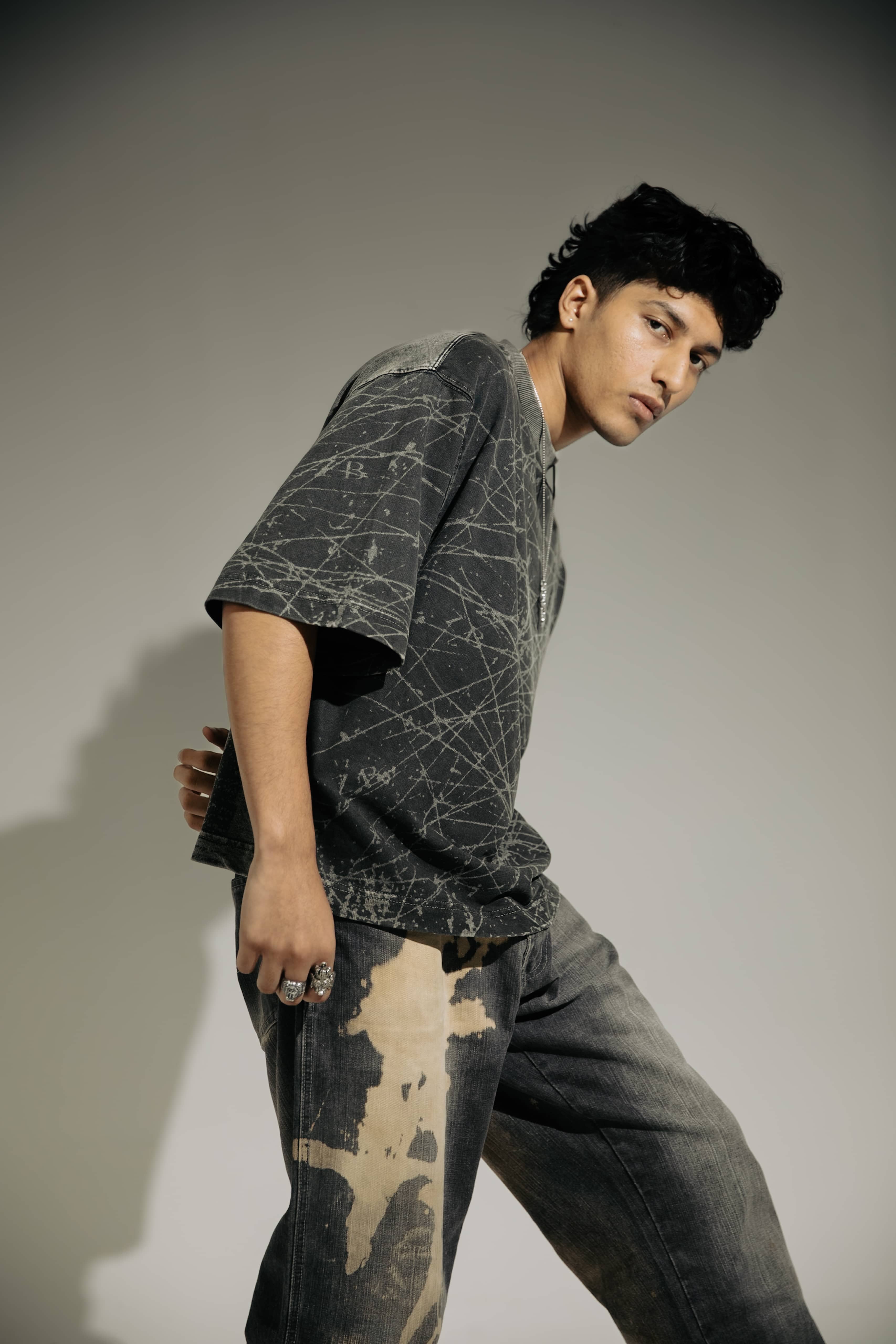 Urban fashion oversized black t-shirt with acid-wash effect, ideal for streetwear