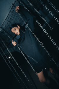 Versatile black oversized shirt with a relaxed fit, ideal for casual or streetwear looks, crafted from eco-friendly materials