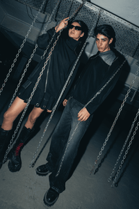 Comfortable oversized black shirt with a relaxed fit, designed for streetwear looks with eco-friendly fabric and modern styling