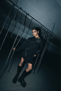 Black oversized shirt with a relaxed fit, designed for street style and made with breathable, sustainable fabric