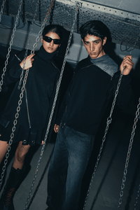 Black oversized shirt with a relaxed fit, featuring bold double zip detailing for a stylish, contemporary streetwear look