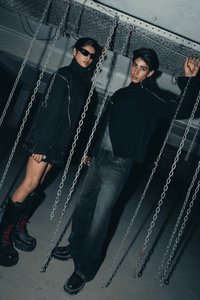 Black streetwear shirt made from breathable banana crepe fabric, with a modern relaxed fit and unique double zip detail enhancing its urban style