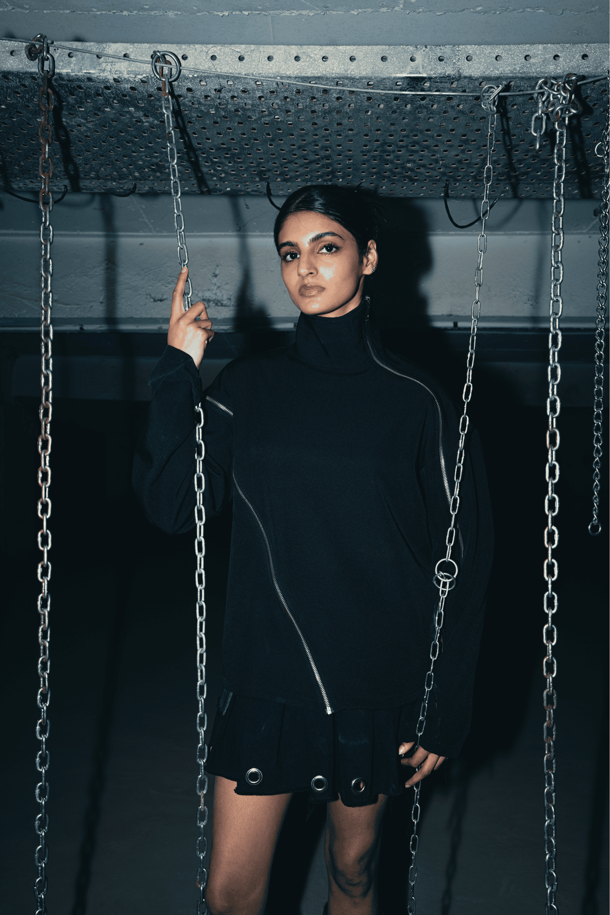 Black oversized shirt featuring a relaxed fit and double zip detail, perfect for a bold streetwear look and eco-conscious fashion