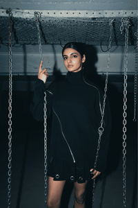 Black oversized shirt featuring a relaxed fit and double zip detail, perfect for a bold streetwear look and eco-conscious fashion