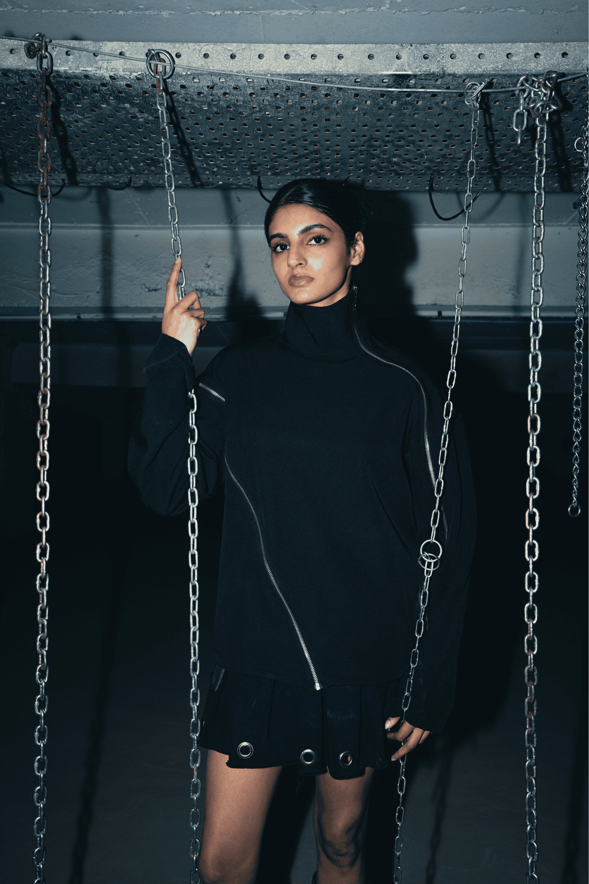 Black oversized shirt featuring a relaxed fit and double zip detail, perfect for a bold streetwear look and eco-conscious fashion