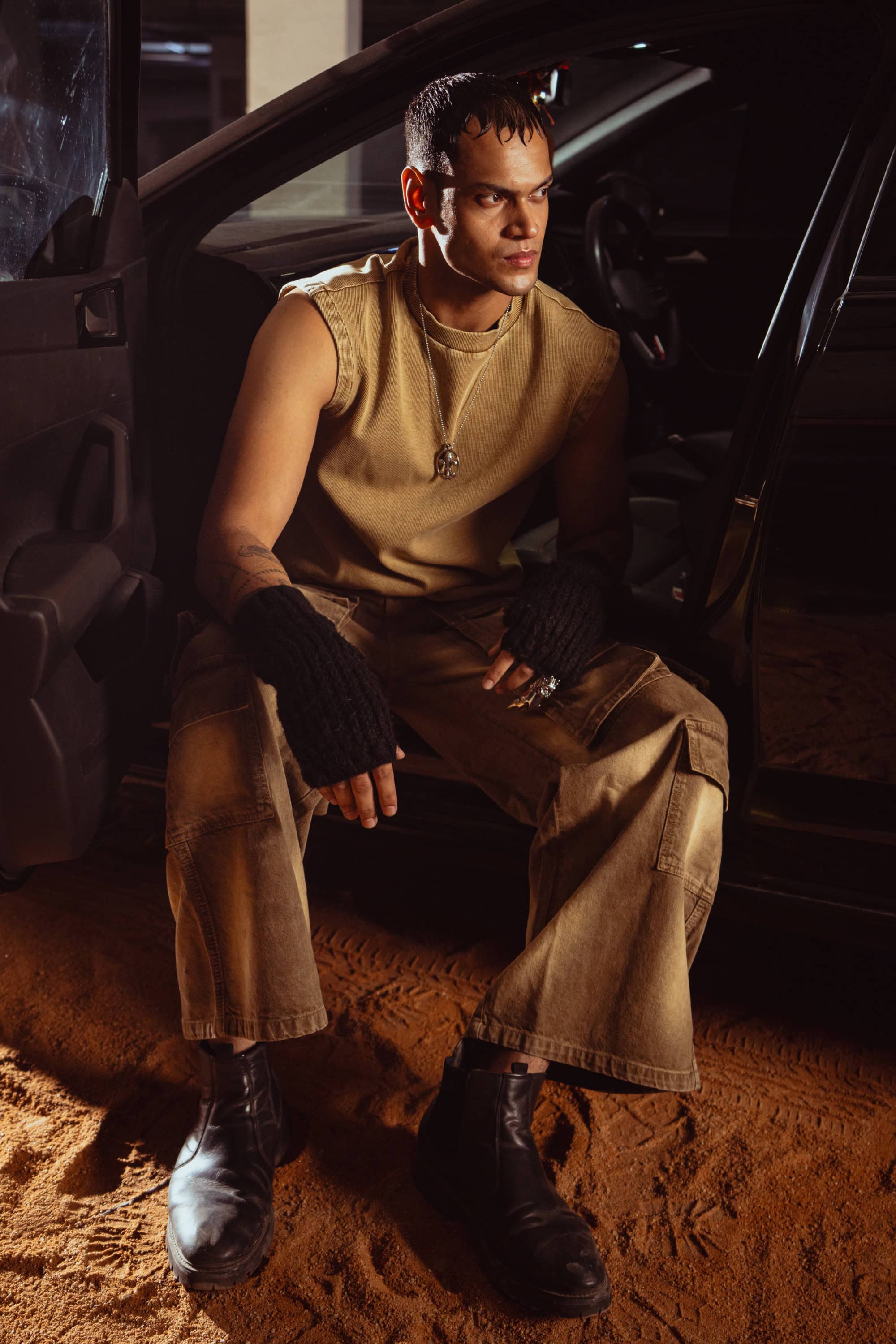 Beige tank top styled for layering, creating the perfect casual streetwear outfit for men