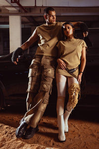 tank top paired with layered accessories, showcasing fashionable beige streetwear styling