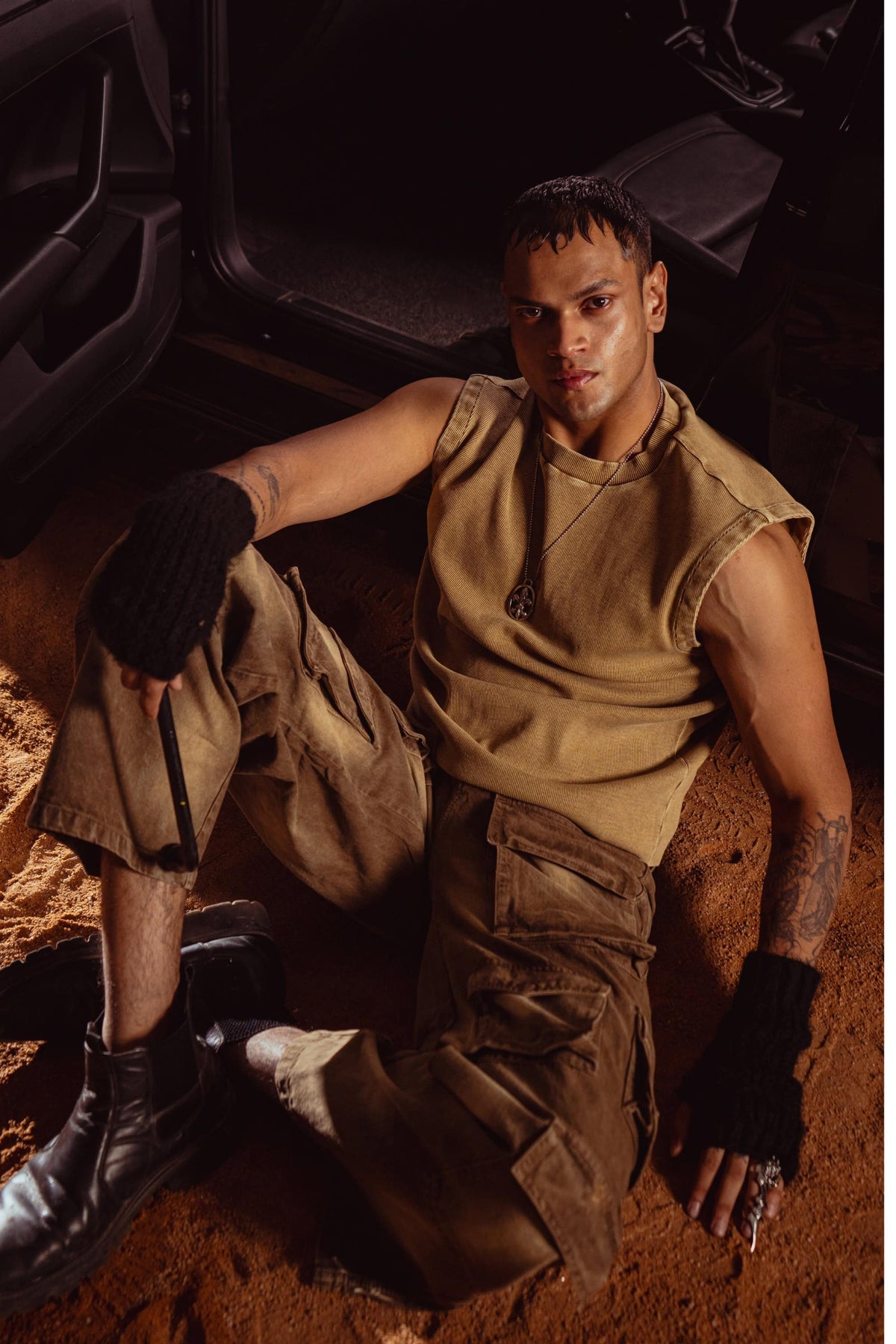 Close-up of beige knit texture on tank top showing fabric quality and stitching detail