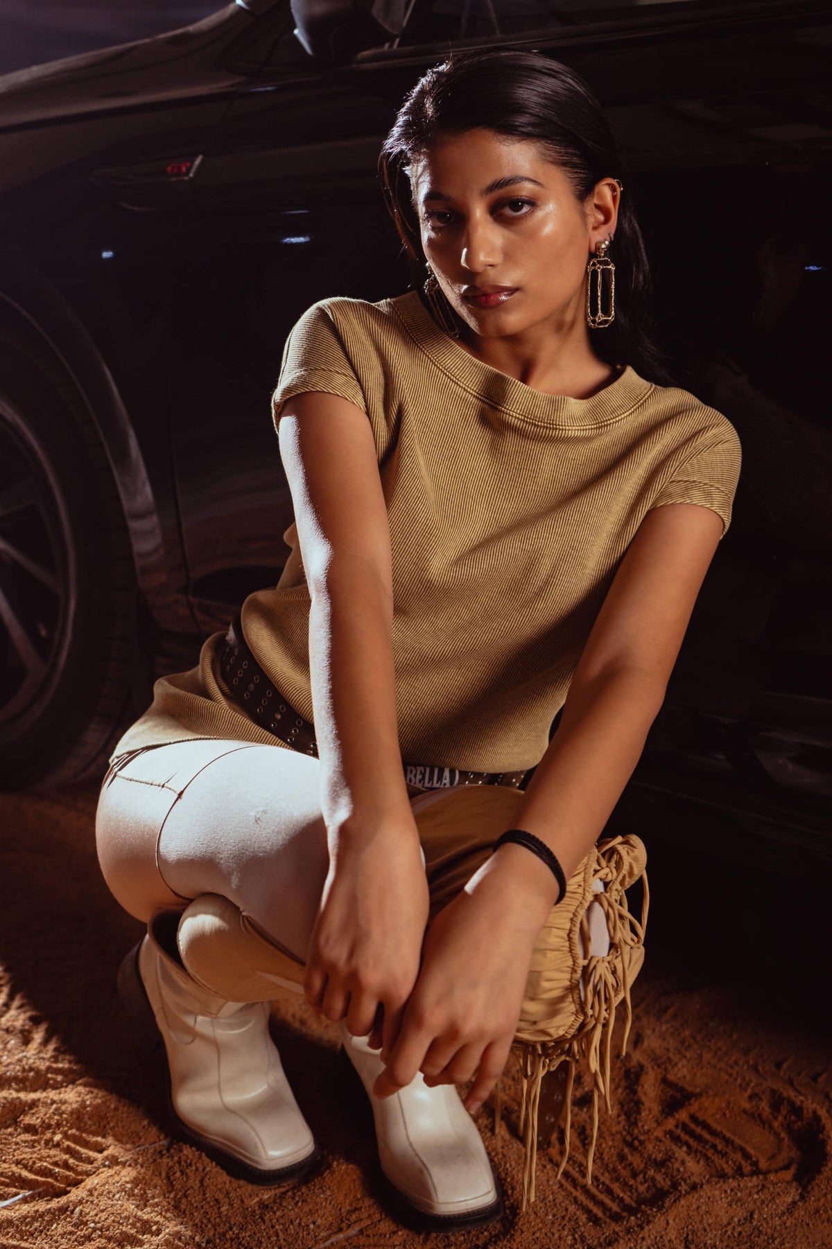 Minimalist beige tank top shot, focusing on clean lines and simple styling for modern men’s fashion