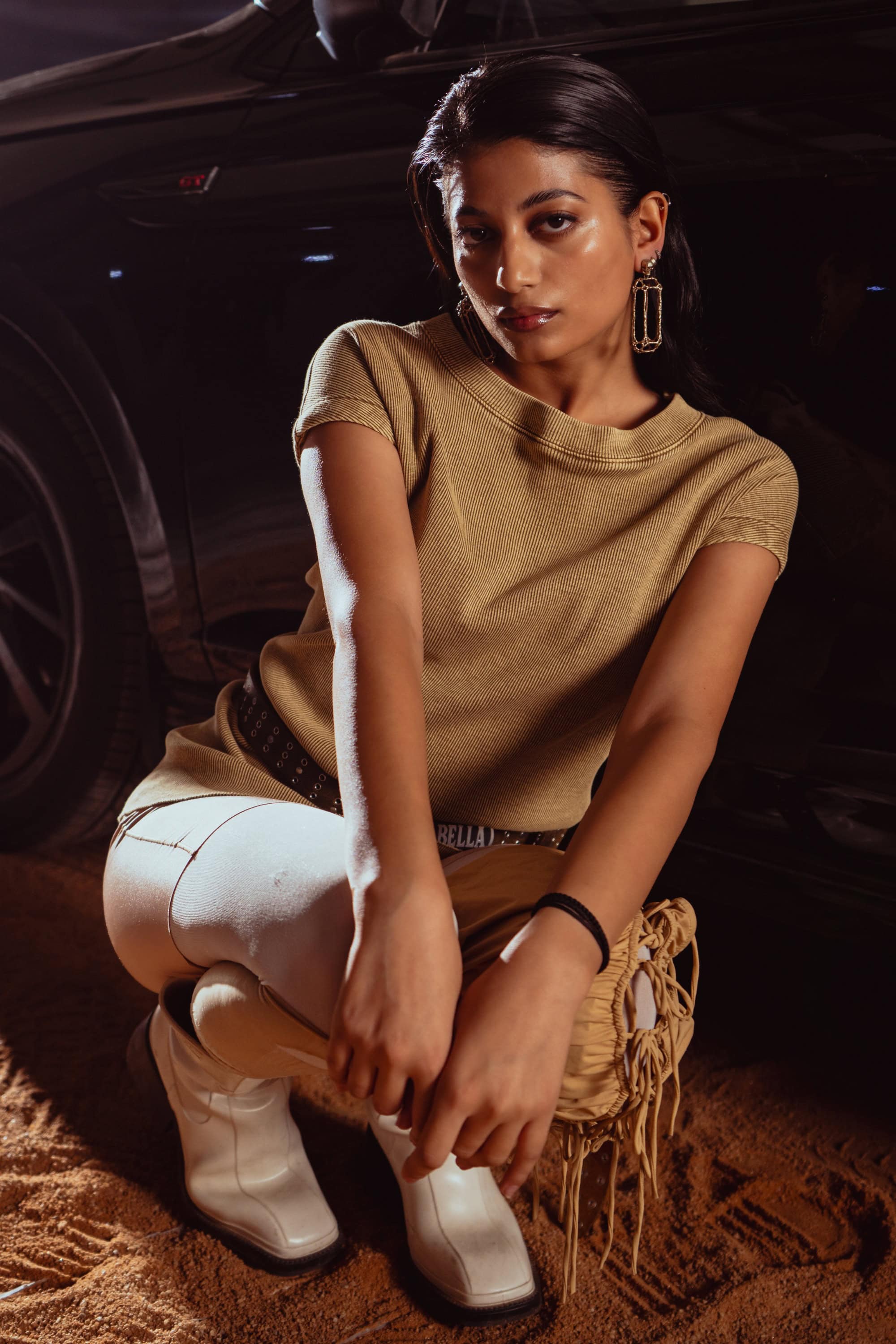 Minimalist beige tank top shot, focusing on clean lines and simple styling for modern men’s fashion