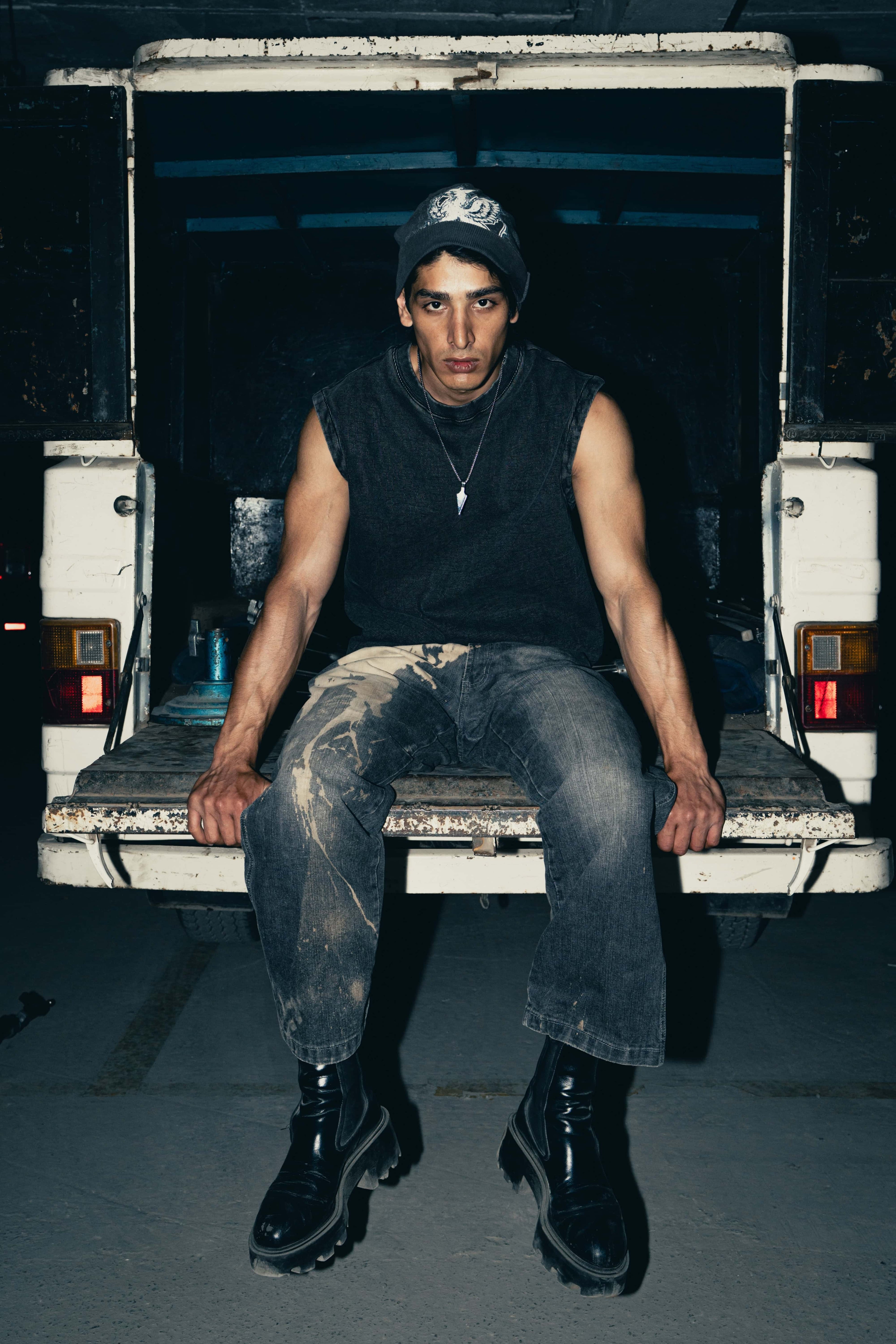 Slim-fit charcoal cotton tank top with a graphic design, tailored for streetwear fashion, delivering a stylish and edgy look