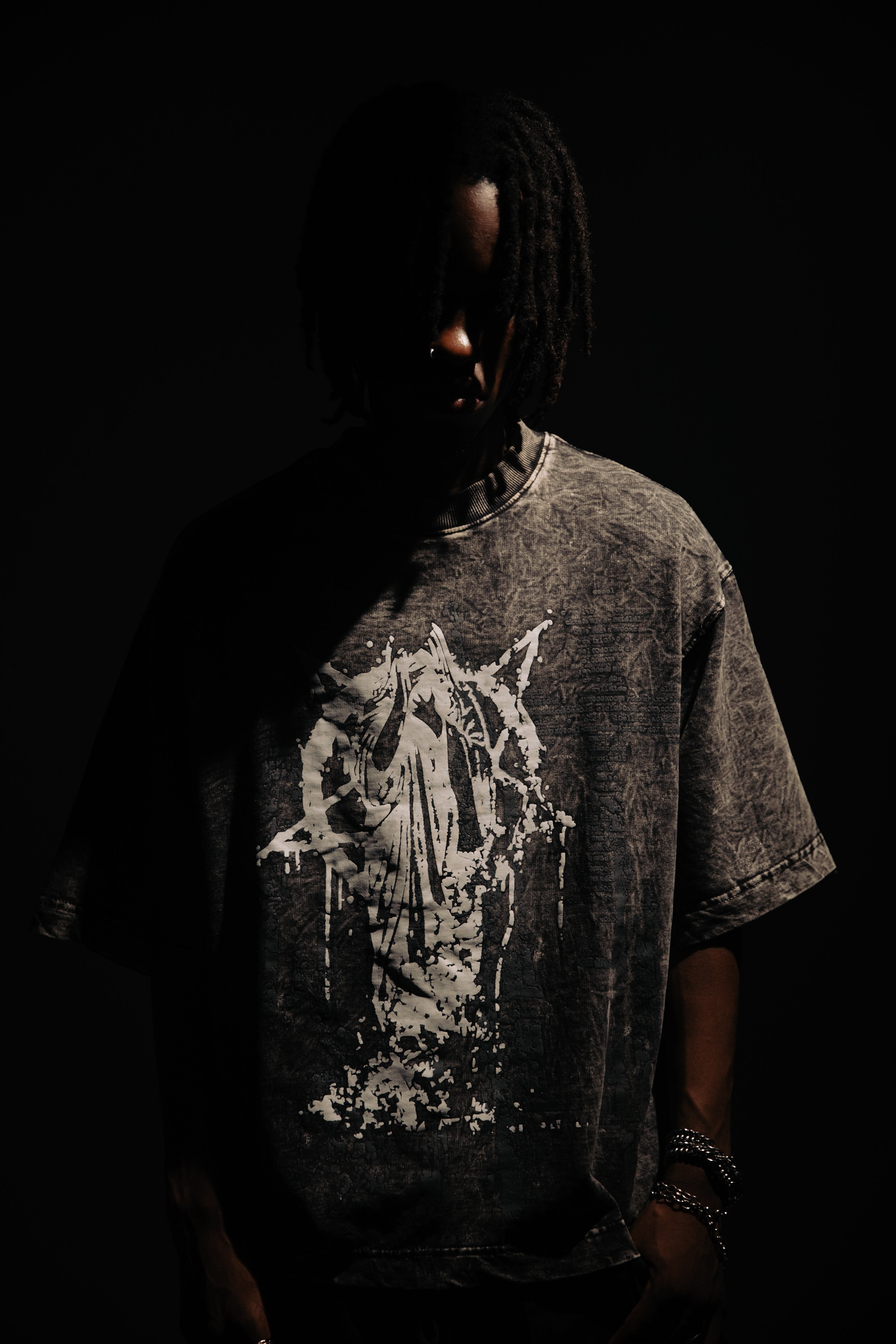 Black vintage wash 100% cotton t-shirt featuring distressed graphic artwork and oversized fit