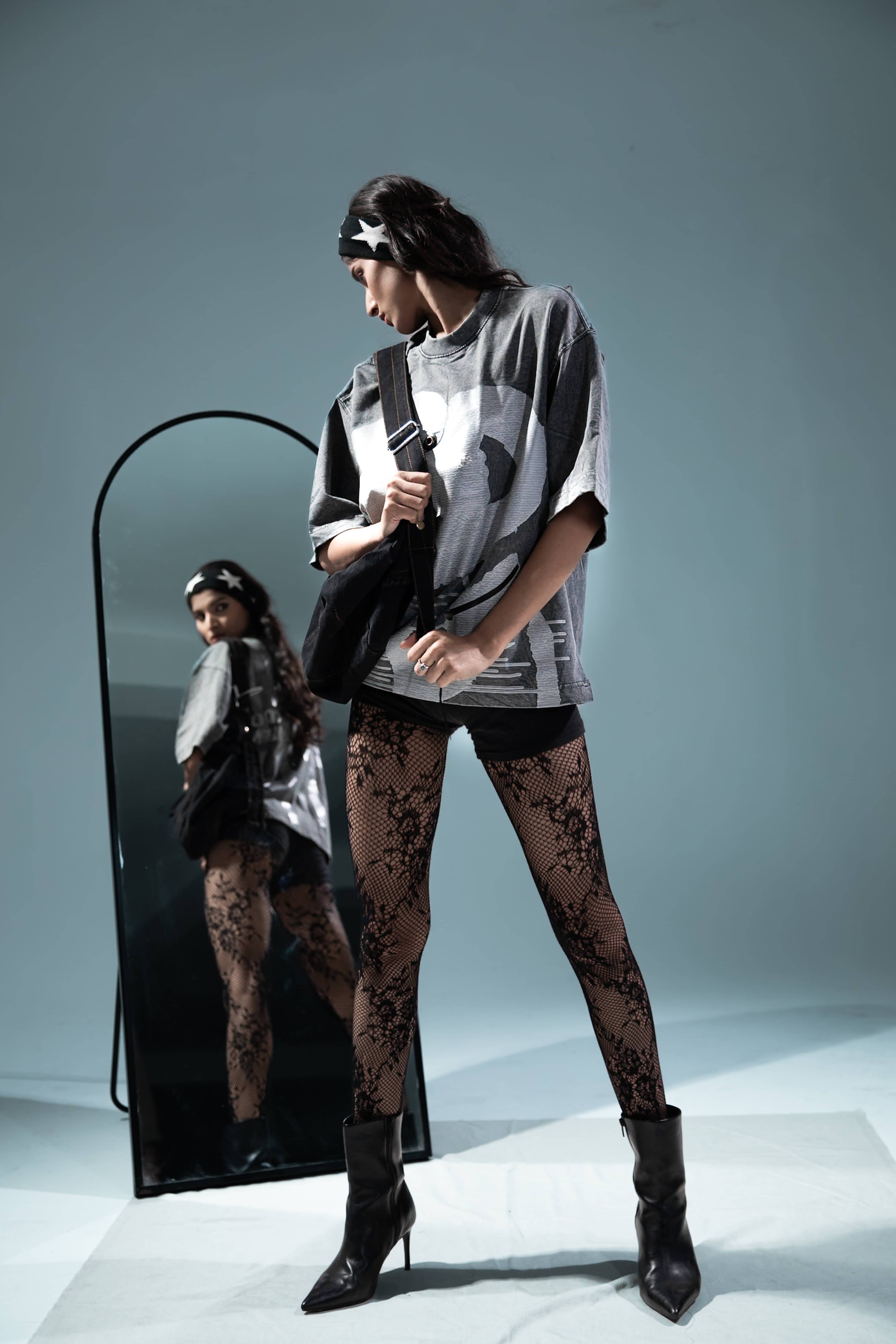 Mirror reflection of grey oversized graphic t-shirt, modern urban look