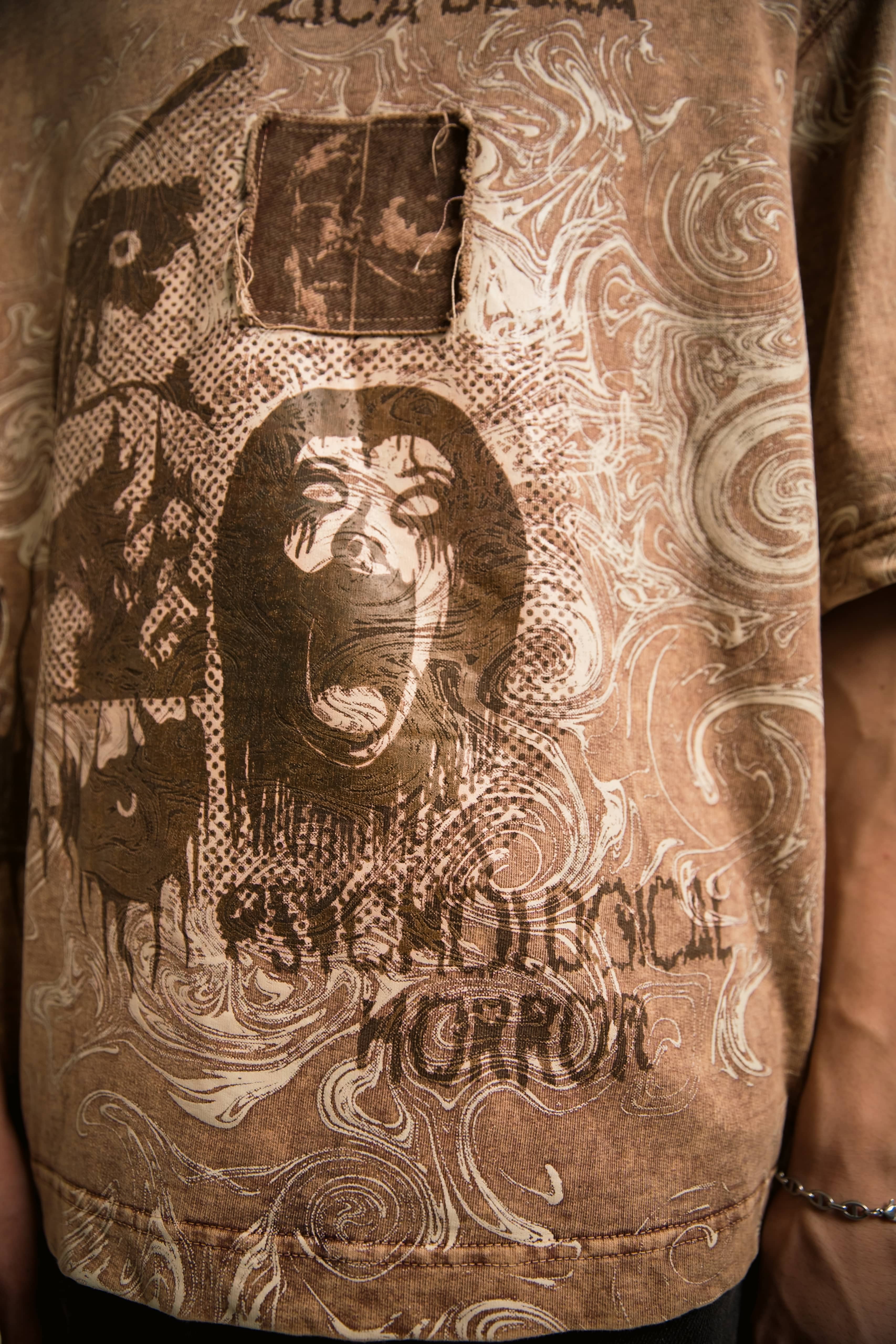 front graphic oversized streetwear 100% cotton t-shirt in stone taupe showcasing symbolic artwork inspired by psychological themes