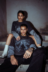 Heavyweight cotton T-shirt with relaxed fit, featuring a bold graphic print in washed black for a modern street look