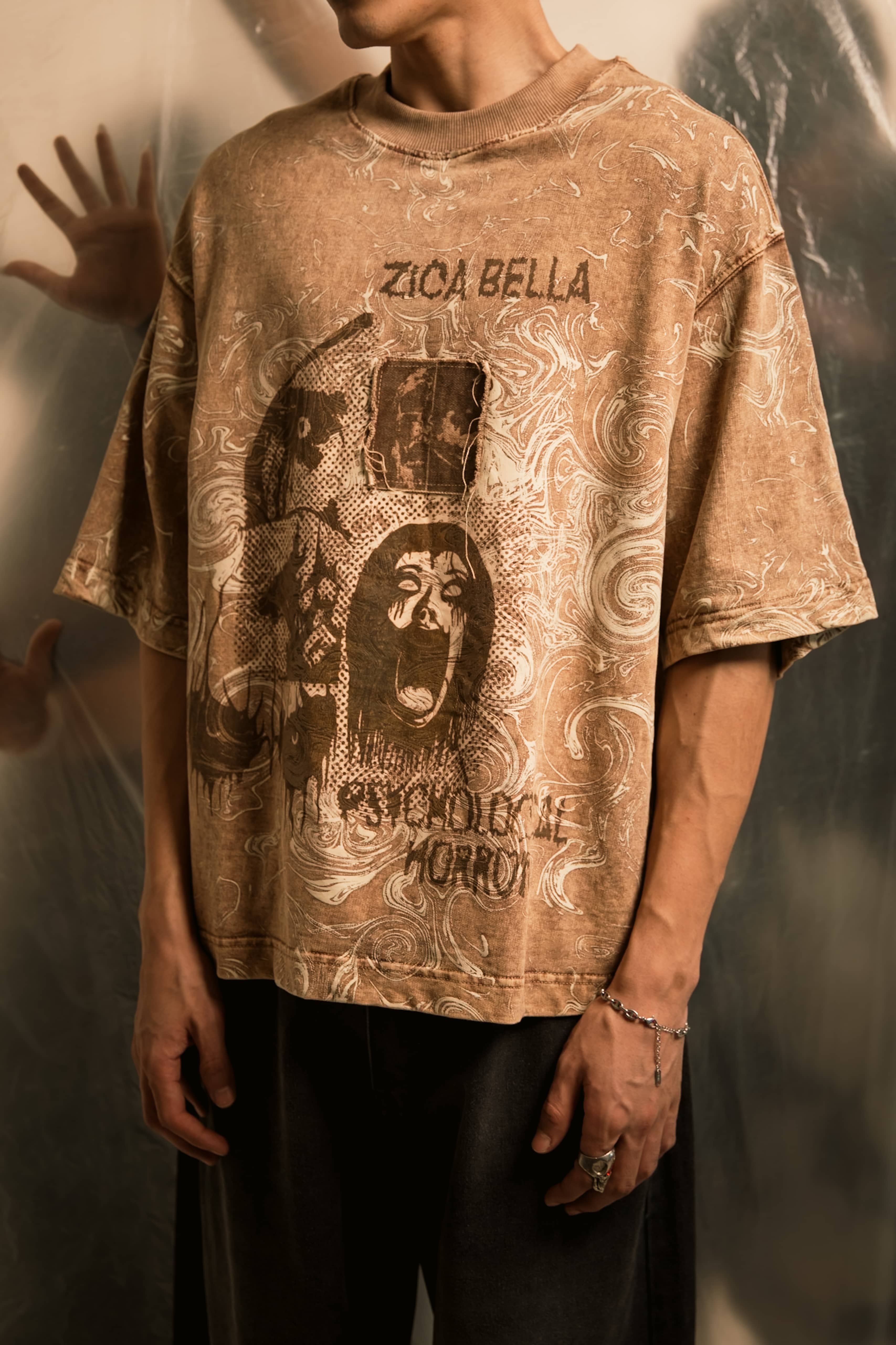 Close-up of horror graphic print on oversized streetwear 240 gsm t-shirt crafted for statement-making urban fashion