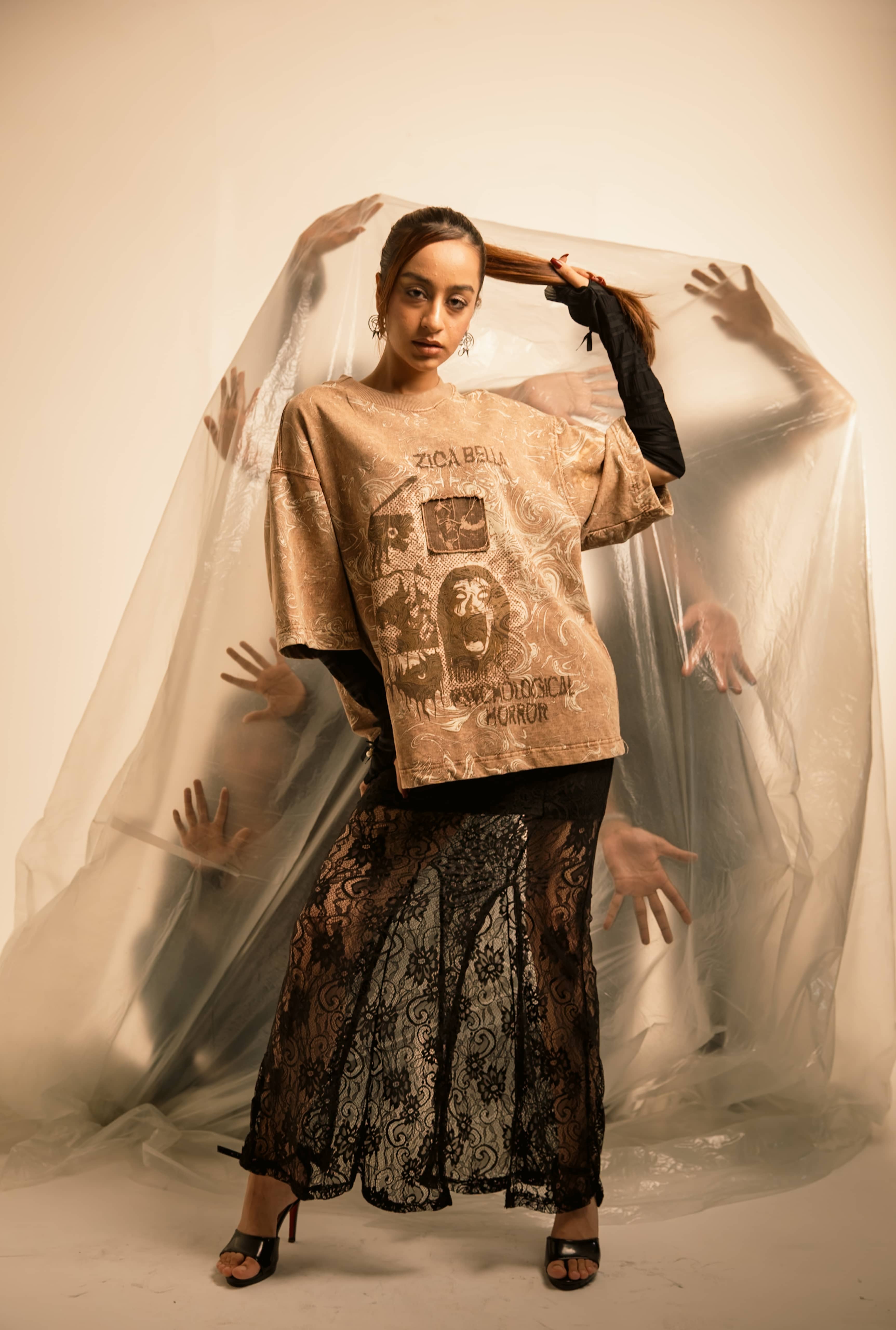 Oversized stone taupe premium cotton t-shirt styled for high-fashion streetwear with expressive psychological horror artwork