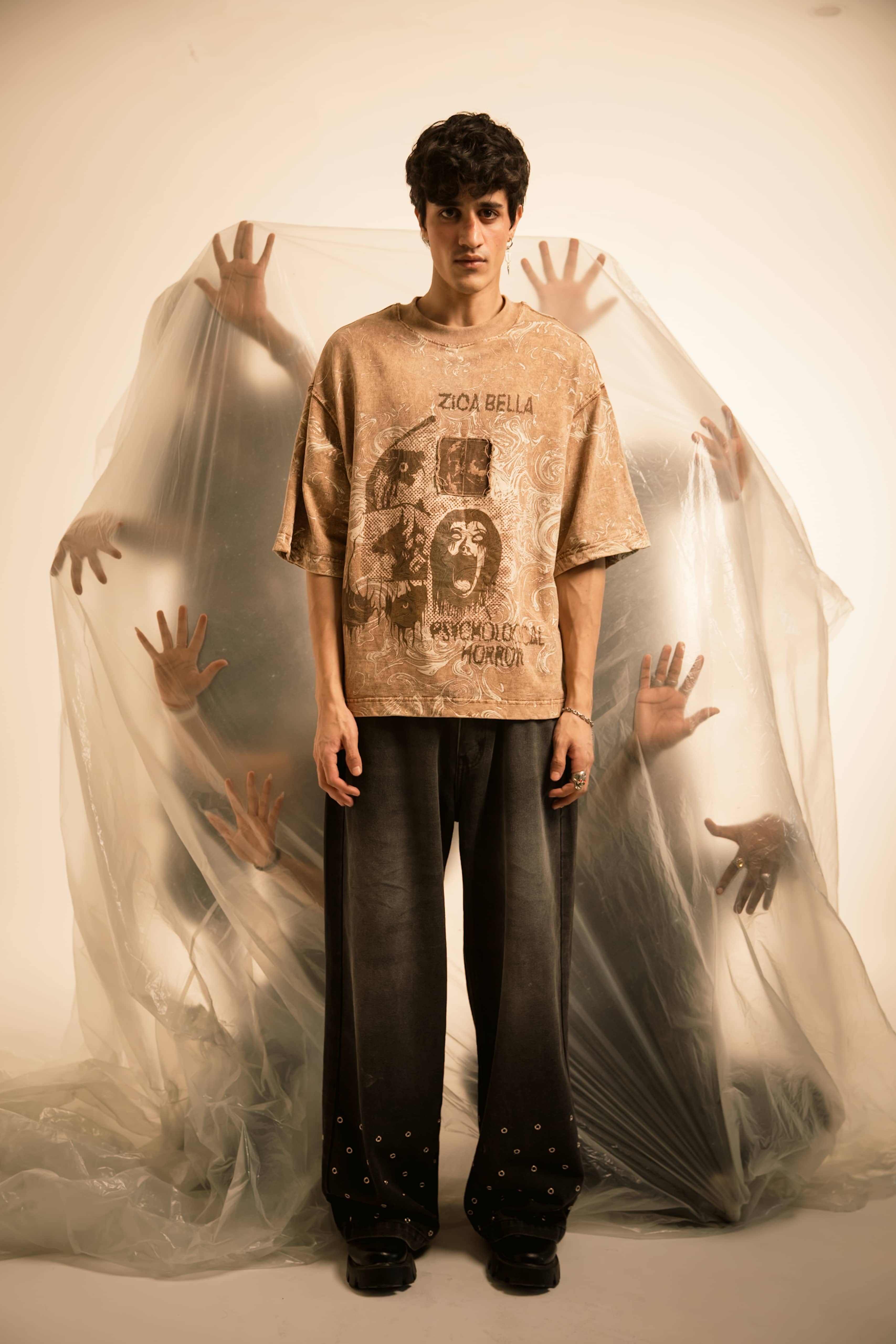 Stone taupe relaxed fit premium cotton t-shirt styled in a full body streetwear look with bold horror-inspired graphic print