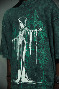 Graphic T-shirt in premium cotton, green oversized fit with a bold hooded figure design. Modern streetwear style with high-quality material and acid wash by zica bella